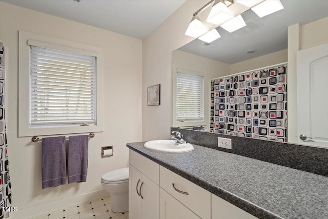 full bath featuring baseboards, toilet, a shower with curtain, tile patterned floors, and vanity