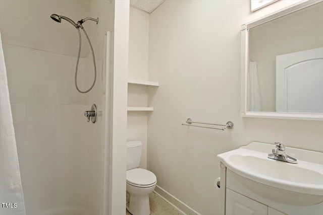 bathroom with baseboards, toilet, vanity, and a shower with curtain