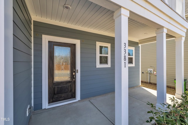 doorway to property featuring covered porch