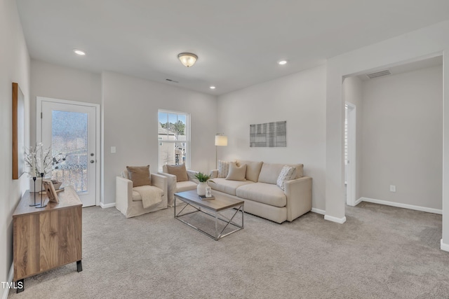 living area with recessed lighting, carpet, visible vents, and baseboards