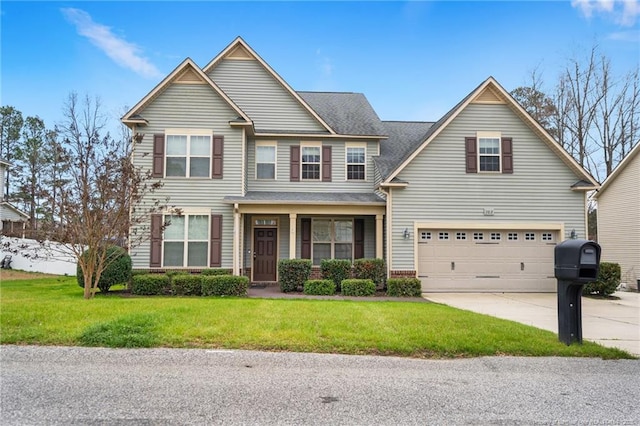 view of front of house featuring a garage, concrete driveway, and a front yard