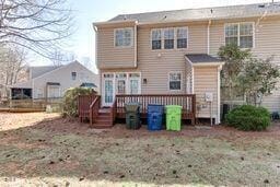 back of property with a wooden deck