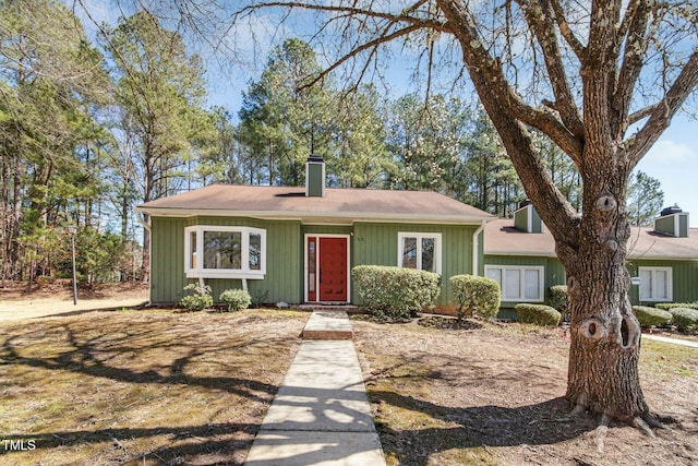 view of front of house featuring a chimney