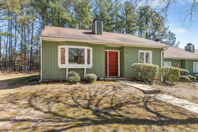 view of front of home featuring a chimney