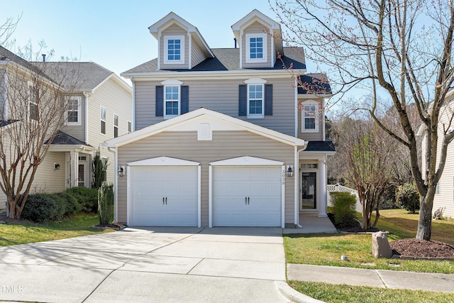 view of front of property featuring an attached garage and driveway