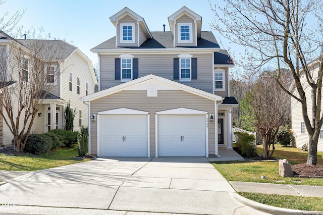 view of front of house with a garage and driveway