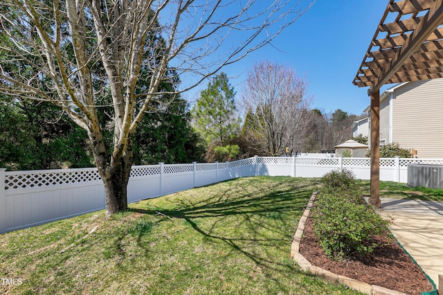 view of yard featuring a pergola and a fenced backyard