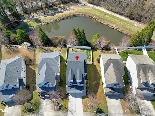 bird's eye view with a residential view and a water view