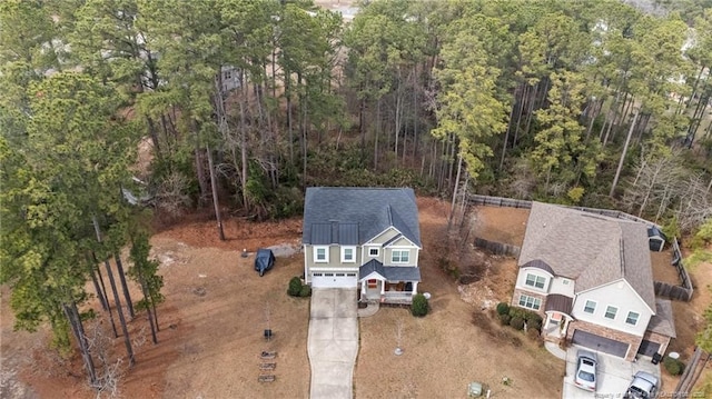 63 Slate Dr, Spring Lake, NC 28390 - aerial view of property and surrounding area featuring a heavily wooded area