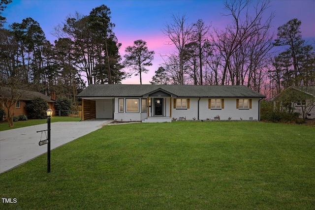 single story home featuring crawl space, a front lawn, a garage, and driveway