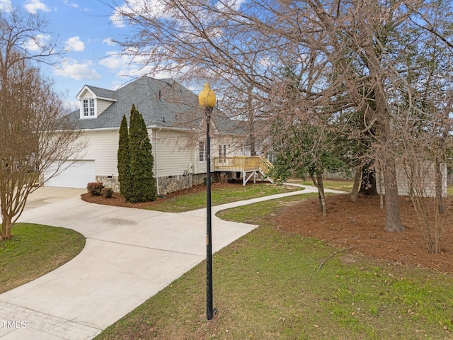 view of property exterior with a garage, a lawn, roof with shingles, concrete driveway, and crawl space