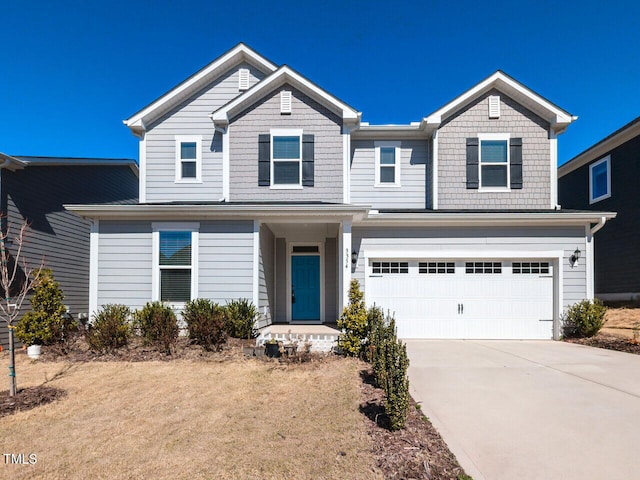 view of front facade with driveway and an attached garage