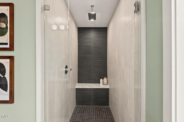 bathroom with tiled shower