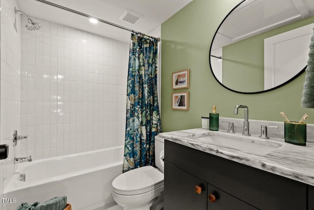 bathroom featuring visible vents, shower / bath combo with shower curtain, toilet, and vanity