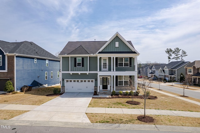 view of front of property featuring a garage, a residential view, board and batten siding, and driveway