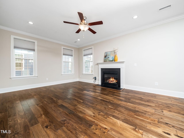 unfurnished living room featuring plenty of natural light, a ceiling fan, and crown molding