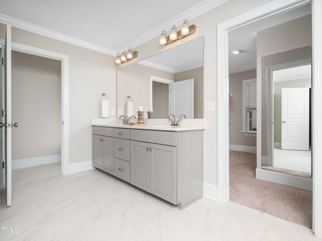 full bath with double vanity, baseboards, marble finish floor, and ornamental molding