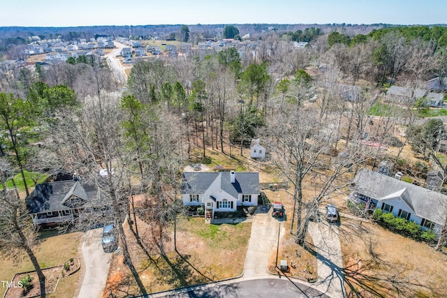 bird's eye view featuring a wooded view