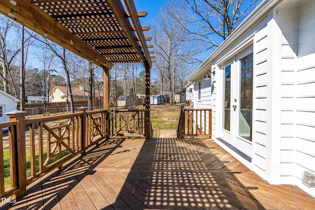 deck with a pergola and fence