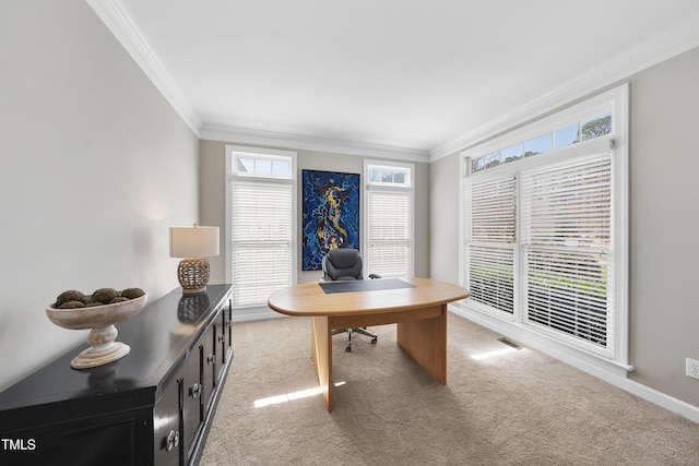 office space with visible vents, light carpet, baseboards, and crown molding