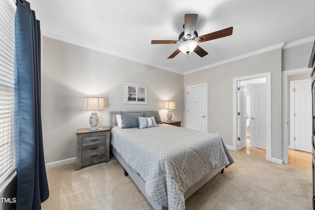 bedroom with ceiling fan, baseboards, light colored carpet, and ornamental molding