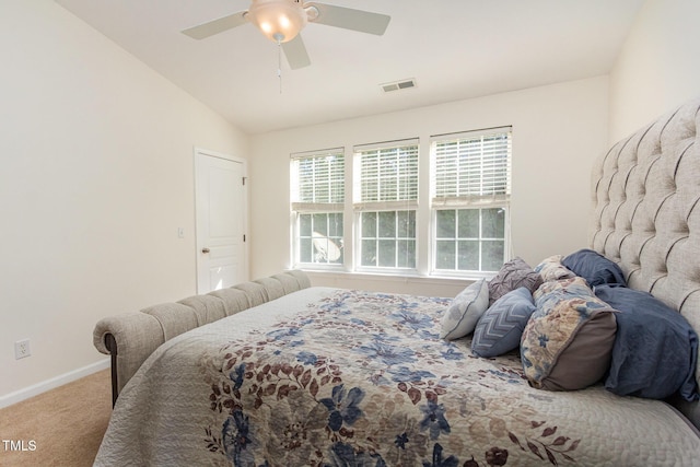 bedroom featuring baseboards, visible vents, carpet floors, lofted ceiling, and ceiling fan