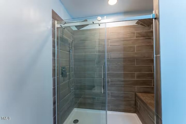 full bathroom featuring a stall shower