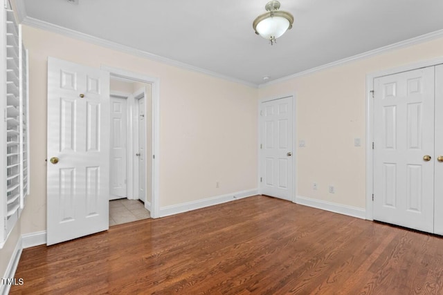 405 Silver Creek Trl, Chapel Hill, NC 27514 - unfurnished bedroom featuring crown molding, wood finished floors, and two closets