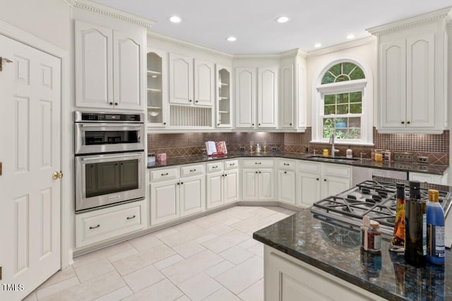 405 Silver Creek Trl, Chapel Hill, NC 27514 - kitchen featuring double oven, dark stone counters, tasteful backsplash, glass insert cabinets, and recessed lighting