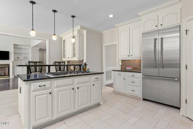 405 Silver Creek Trl, Chapel Hill, NC 27514 - kitchen featuring appliances with stainless steel finishes, decorative backsplash, hanging light fixtures, glass insert cabinets, and crown molding
