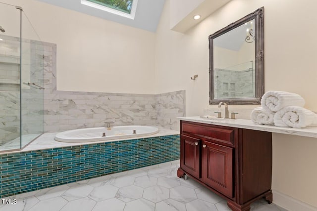 405 Silver Creek Trl, Chapel Hill, NC 27514 - bathroom featuring a skylight, a garden tub, vanity, tile patterned floors, and a shower