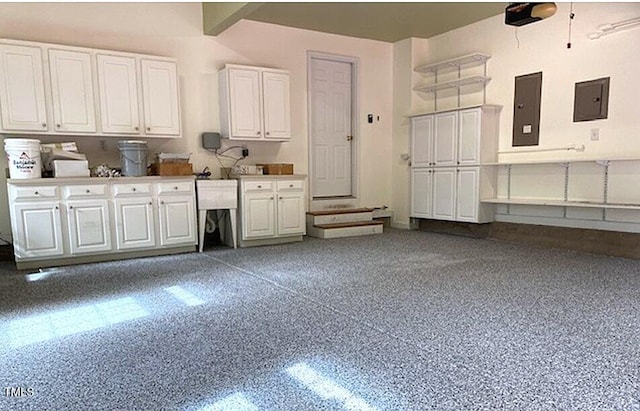 405 Silver Creek Trl, Chapel Hill, NC 27514 - kitchen with electric panel, white cabinetry, and light aggregate flooring