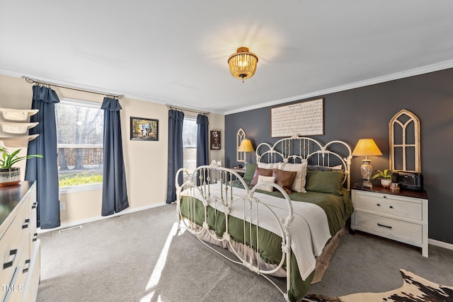 bedroom featuring visible vents, baseboards, carpet floors, and ornamental molding