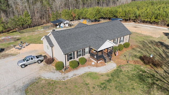 bird's eye view featuring a wooded view