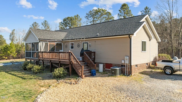 rear view of house with crawl space, central AC unit, roof with shingles, and a sunroom