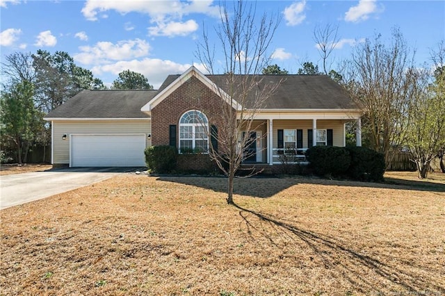 ranch-style home featuring brick siding, a front lawn, a porch, concrete driveway, and a garage