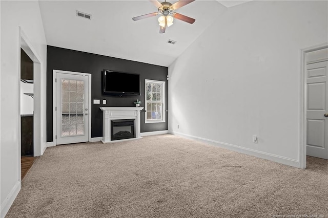 unfurnished living room featuring visible vents, carpet, and a fireplace