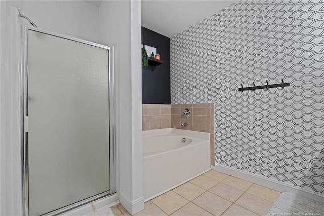 full bathroom with a garden tub, a stall shower, and tile patterned flooring