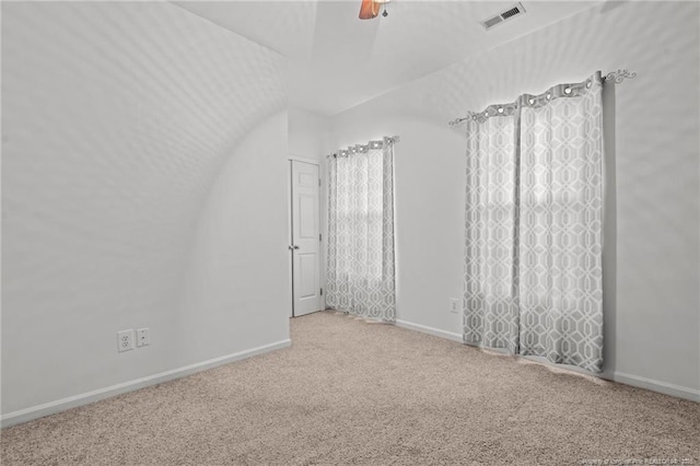 unfurnished room featuring visible vents, ceiling fan, baseboards, and carpet