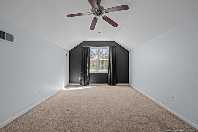 bonus room featuring visible vents, a ceiling fan, baseboards, carpet flooring, and lofted ceiling