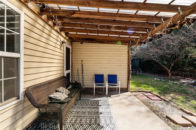 view of patio with a trampoline, outdoor lounge area, and a pergola