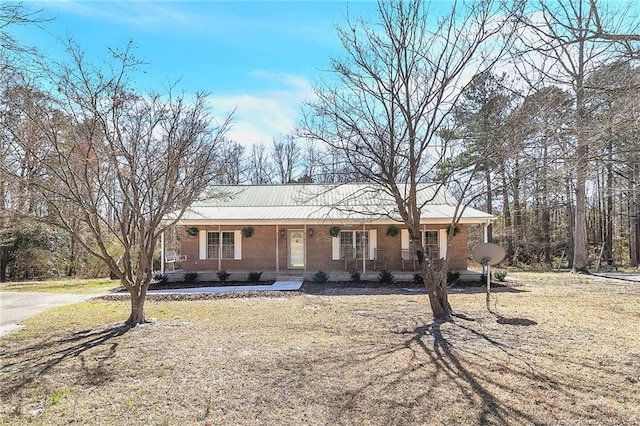 ranch-style house with brick siding and covered porch