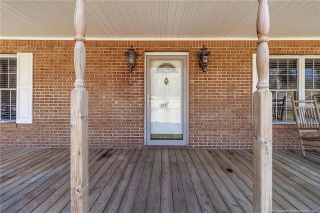 property entrance with brick siding