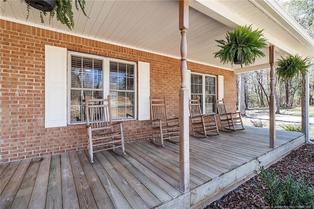 wooden terrace with a porch