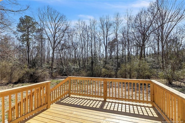 deck featuring a wooded view