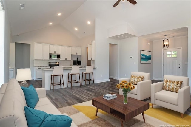 5814 James Allen Ln, Stedman, NC 28391 - living area with wood finished floors, a ceiling fan, recessed lighting, and high vaulted ceiling