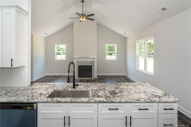 5814 James Allen Ln, Stedman, NC 28391 - kitchen with dishwasher, ceiling fan, dark wood-style flooring, light stone counters, and white cabinetry