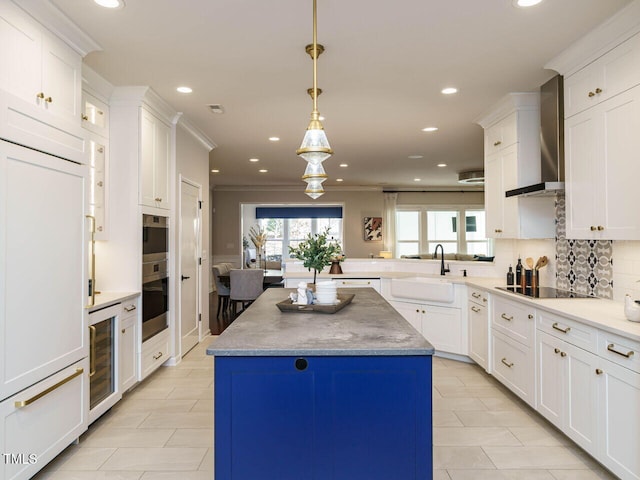 kitchen featuring beverage cooler, a sink, wall chimney exhaust hood, stainless steel oven, and black electric cooktop