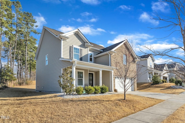 traditional-style home with a garage and driveway