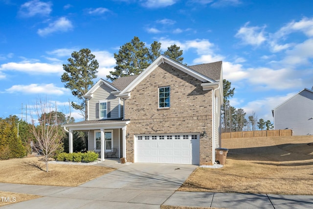 traditional-style home featuring fence, covered porch, concrete driveway, a garage, and brick siding